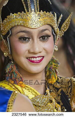 Indonesia, Bali, Portrait of young Legong Dancer waiting to perform at annual Bali Arts Festival held in Denpasar. Running for month of July festival is a top showcase for both Balanese and other Indonesian dance troupes; Denpasar View Large Photo Image Stock Photograph - Indonesia, Bali, Portrait of young Legong Dancer waiting to perform at annual Bali Arts Festival held in Denpasar. Running for month of July festival is a top showcase for both Balanese and other Indonesian dance troupes; Denpasar. Fotosearch