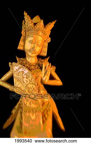 Stock Image - Indonesia, Bali, Statue Of An Indonesian Dancer.. Fotosearch