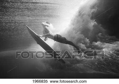 Indonesia, Bali, Surfer Duck Dives Under Wave, View From Underwater, Black And White View Large Photo Image Stock Photography - Indonesia, Bali, Surfer Duck Dives Under Wave, View From Underwater, Black And White. Fotosearch