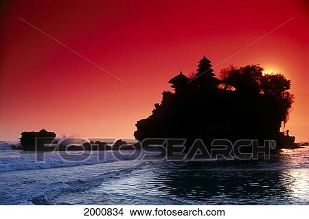 Picture - Indonesia, Bali, Tanah Lot Silhouetted By Dramatic Red Sunset Skies. Fotosearch