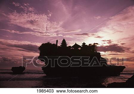 Stock Image - Indonesia, Bali, Tanah Lot Temple Silhouetted At Sunset.. Fotosearch