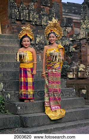 Indonesia, Bali, Two Young Legong Dancers In Full Costume, Stand On Steps, Smiling View Large Photo Image Stock Image - Indonesia, Bali, Two Young Legong Dancers In Full Costume, Stand On Steps, Smiling. Fotosearch