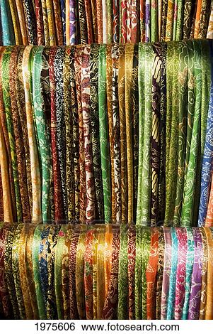 Stock Photograph - Indonesia, Bali, Ubud, Silk Scarves For Sale At Market.. Fotosearch