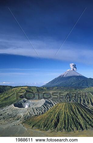 Stock Image - Indonesia, Java, Bromo Tengger Semeru National Park Overview, Volcano Erupts Background. Fotosearch