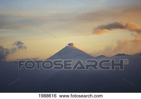 Stock Photograph - Indonesia, Java, Bromo Tengger Semeru National Park, Smoky Active Volcano, Misty Sunset Sky. Fotosearch