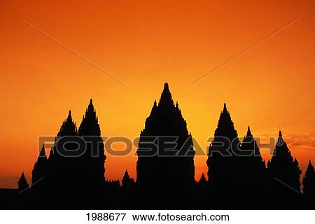 Indonesia, Java, Prambanan, Shiva Mahadeva Temple Silhouetted At Sunset View Large Photo Image Stock Photo - Indonesia, Java, Prambanan, Shiva Mahadeva Temple Silhouetted At Sunset. Fotosearch