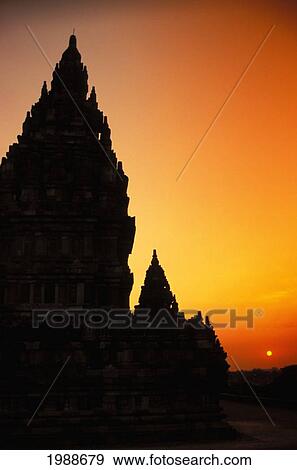 Indonesia, Java, Prambanan, Shiva Mahadeva Temple Silhouetted At Sunset View Large Photo Image Stock Photo - Indonesia, Java, Prambanan, Shiva Mahadeva Temple Silhouetted At Sunset. Fotosearch