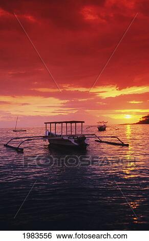 Indonesia, Lombok, Boats on sea at sunset; Sengigi View Large Photo Image Stock Photograph - Indonesia, Lombok, Boats on sea at sunset; Sengigi. Fotosearch