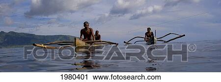 Stock Image - Indonesia, Pura Island, Two Outrigger Canoes Of Native Fisherman.. Fotosearch
