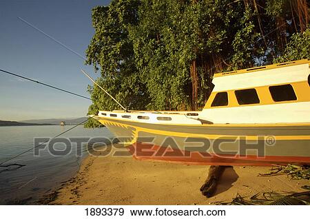 Indonesia, Sulawesi, Boat on Sandy Beach; Bunaken View Large Photo Image Stock Photo - Indonesia, Sulawesi, Boat on Sandy Beach; Bunaken. Fotosearch