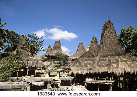 Indonesia, Traditional houses with Megalithic Monuments; Sumba Island View Large Photo Image Stock Photo - Indonesia, Traditional houses with Megalithic Monuments; Sumba Island. Fotosearch
