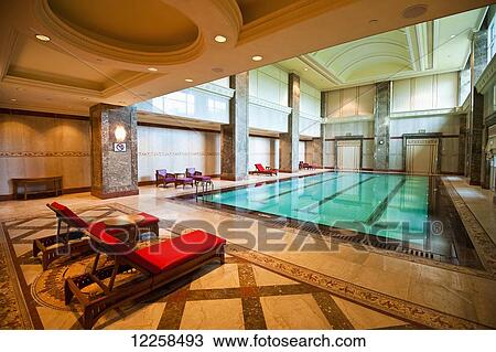 Indoor pool at the Empire Hotel and Country Club; Bandar Seri Begawan, Brunei View Large Photo Image Stock Image - Indoor pool at the Empire Hotel and Country Club; Bandar Seri Begawan, Brunei. Fotosearch