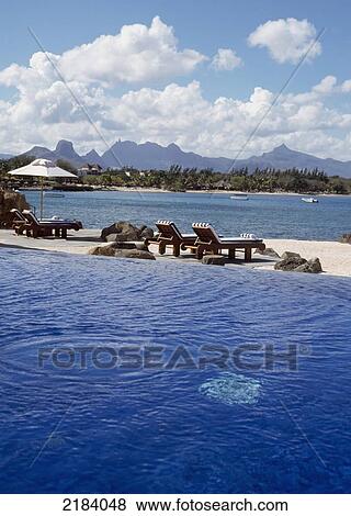 Stock Photo - Infinity pool, swimming pool, Oberoi Hotel, Mauritius.. Fotosearch