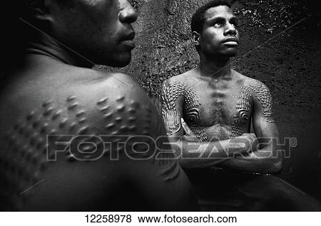 Initiates from the crocodile scarification ceremony; Sepik River, Papua New Guinea View Large Photo Image Stock Photo - Initiates from the crocodile scarification ceremony; Sepik River, Papua New Guinea. Fotosearch