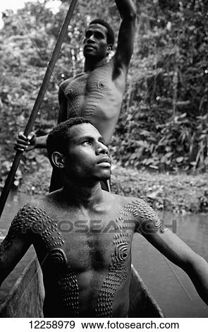 Initiates from the crocodile scarification ceremony; Sepik River, Papua New Guinea View Large Photo Image Stock Photo - Initiates from the crocodile scarification ceremony; Sepik River, Papua New Guinea. Fotosearch