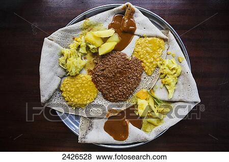 Stock Photo - Injera, traditional Ethiopian food, with vegetarian fasting wat; Ethiopia. Fotosearch