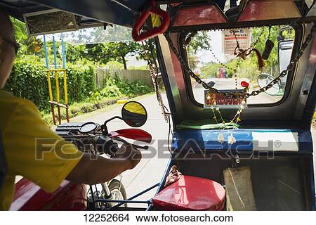 Picture - Inside of a tuk tuk, the most popular transportation around Philippines; Boracay, Panay, Philippines. Fotosearch