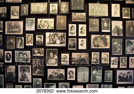 Stock Image - Installation At The Sauna Displaying Photographs Found Among The Belongings Of People Murdered At The Auschwitz-Birkenau Concentration Camp, Oswiecim, Malopolska, Poland. Fotosearch