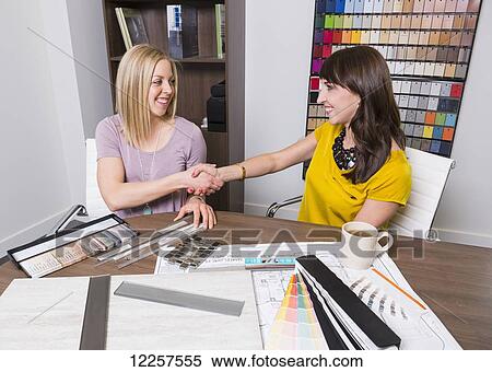 Interior designer and design consultant meet to select paint and tile samples; Edmonton, Alberta, Canada View Large Photo Image Stock Photography - Interior designer and design consultant meet to select paint and tile samples; Edmonton, Alberta, Canada. Fotosearch