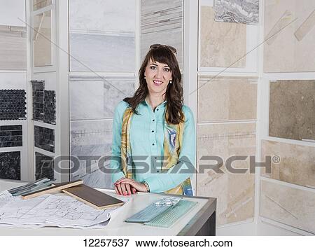Interior designer selecting tiles in showroom of tile store; Edmonton, Alberta, Canada View Large Photo Image Stock Photo - Interior designer selecting tiles in showroom of tile store; Edmonton, Alberta, Canada. Fotosearch