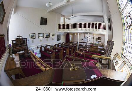 Interior of a church with a Bible on display viewed through a fisheye lens; Lake District, Cumbria, England View Large Photo Image Stock Image - Interior of a church with a Bible on display viewed through a fisheye lens; Lake District, Cumbria, England. Fotosearch