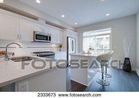 Stock Image - Interior Of Modern Kitchen With Island; Surrey, British Columbia, Canada. Fotosearch
