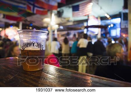 Stock Photo - Interior Of Sloppy Joes Bar Showing A Glass Of Beer; Interior Of Sloppy Joes Bar Showing A Glass Of Beer. Duval Street. Key West. Florida Keys.. Fotosearch
