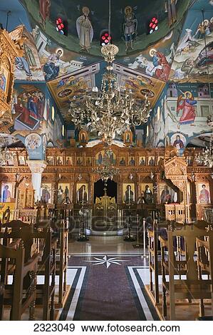Stock Photo - Interior of St Raphael church with colorful paintings on walls; Pachyammos, Cyprus. Fotosearch