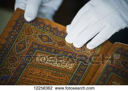 Intricate text of an old Koran at Brunei's Dar al-Salam's Islamic Museum; Bandar Seri Begawan, Brunei View Large Photo Image Stock Image - Intricate text of an old Koran at Brunei's Dar al-Salam's Islamic Museum; Bandar Seri Begawan, Brunei. Fotosearch