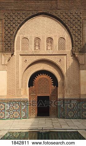 Stock Image - Intricate Wood Carving, Stucco Work And Ceramic Tiles; Ali Ben Youssef Madrasa, Marrakech, Morocco. Fotosearch