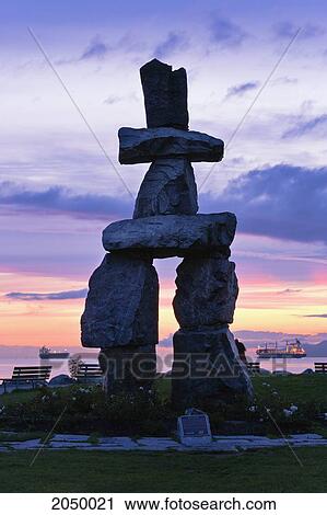 Stock Image - Inukshuk And English Bay At Dusk, Vancouver, British Columbia. Fotosearch