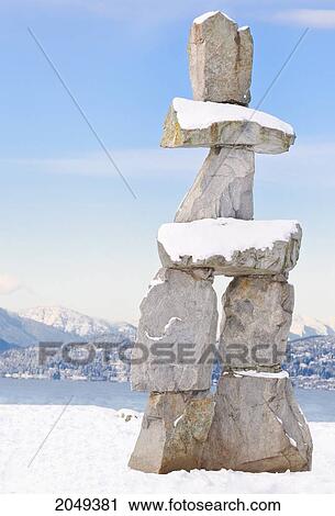 Stock Image - Inukshuk At English Bay In Downtown Vancouver, British Columbia. Fotosearch