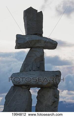 Stock Image - Inukshuk In English Bay At Dusk, Vancouver, British Columbia, Canada. Fotosearch