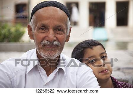 Iranian father and son, Imam Khomeini Mausoleum, Behesht-e Zahra cemetery; Tehran, Iran View Large Photo Image Stock Image - Iranian father and son, Imam Khomeini Mausoleum, Behesht-e Zahra cemetery; Tehran, Iran. Fotosearch