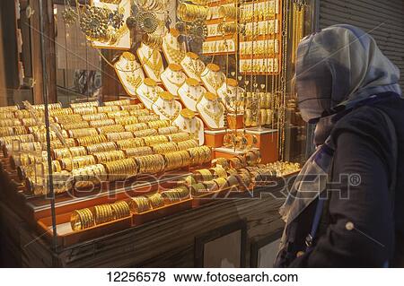 Iranian woman looking at gold shop, Bazaar Vakil; Kerman, Iran View Large Photo Image Stock Photo - Iranian woman looking at gold shop, Bazaar Vakil; Kerman, Iran. Fotosearch