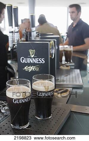 Ireland, Glass Of Beer On Bar Counter; Dublin View Large Photo Image Stock Image - Ireland, Glass Of Beer On Bar Counter; Dublin. Fotosearch