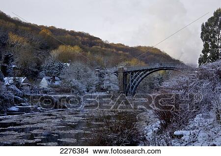 Ironbridge gorge and world's first iron bridge with ice flows in River Severn; Ironbridge, Shropshire, England View Large Photo Image Picture - Ironbridge gorge and world's first iron bridge with ice flows in River Severn; Ironbridge, Shropshire, England. Fotosearch