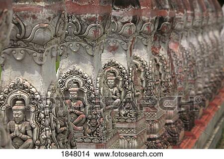 Picture - Isan, Thailand; Row Of Buddhist Temple Carvings. Fotosearch