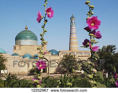 Stock Photo - Islam Khoja minaret (right) and dome of Pakhlavan Mahmoud Mausoleum (left), Ichan Kala Old City; Khiva, Uzbekistan. Fotosearch