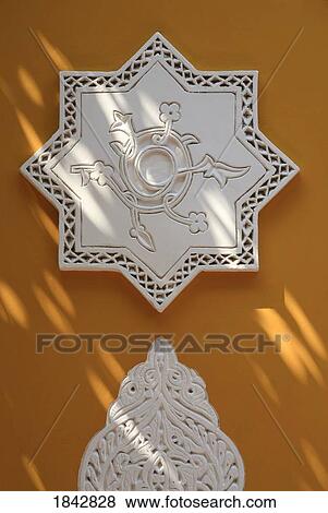 Stock Photo - Islamic Detail On The Ochre Walls Of The Islamic Arts Museum In The Majorelle Gardens; Marrakech, Marrakech, Morocco. Fotosearch
