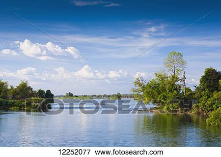 Island of Don Det on the Mekong River along the Cambodia/Laos border; Si Phan Don, Laos View Large Photo Image Stock Photo - Island of Don Det on the Mekong River along the Cambodia/Laos border; Si Phan Don, Laos. Fotosearch