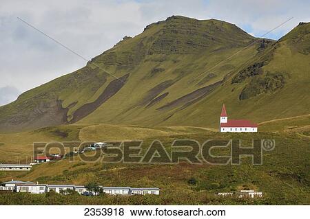 Stock Photo - Isolated Church On Hill Overlooking The Village Of Vik; Vik, Vestur-Skaftafellssysla, Iceland. Fotosearch