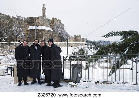 Stock Image - Israel, Jaffa Gate; Jerusalem, 2013, January 10, Group of Jews posing in front of gate. Fotosearch
