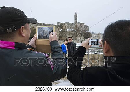 Israel, Jaffa Gate; Jerusalem, Men photographing couple View Large Photo Image Stock Photo - Israel, Jaffa Gate; Jerusalem, Men photographing couple. Fotosearch