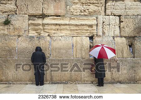 Israel, Jerusalem, Men praying at Western Wall on winter day; Jerusalem Old City View Large Photo Image Stock Photo - Israel, Jerusalem, Men praying at Western Wall on winter day; Jerusalem Old City. Fotosearch