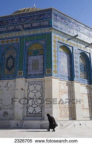 Stock Photography - Israel, Jerusalem Old City, Hunchbacked elderly woman walking by Dome of Rock; Jerusalem. Fotosearch