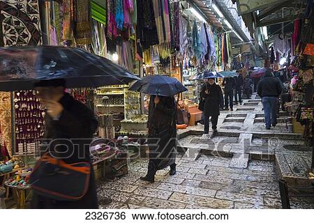 Israel, Jerusalem, Visitors in tourist market on rainy day; Jerusalem Old City View Large Photo Image Stock Photograph - Israel, Jerusalem, Visitors in tourist market on rainy day; Jerusalem Old City. Fotosearch