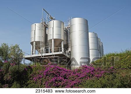 Israel, Jordon Valley, Katzrin, Golan Heights Winery fermenting tanks up on hill above winery View Large Photo Image Stock Image - Israel, Jordon Valley, Katzrin, Golan Heights Winery fermenting tanks up on hill above winery. Fotosearch