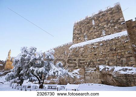Stock Image - Israel, Old City walls and Tower of David under snow; Jerusalem, 2013, January 10. Fotosearch