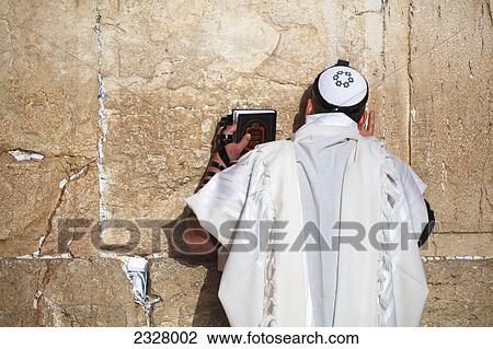 Israel, Rear view of man praying at Wailing wall; Jerusalem View Large Photo Image Stock Image - Israel, Rear view of man praying at Wailing wall; Jerusalem. Fotosearch